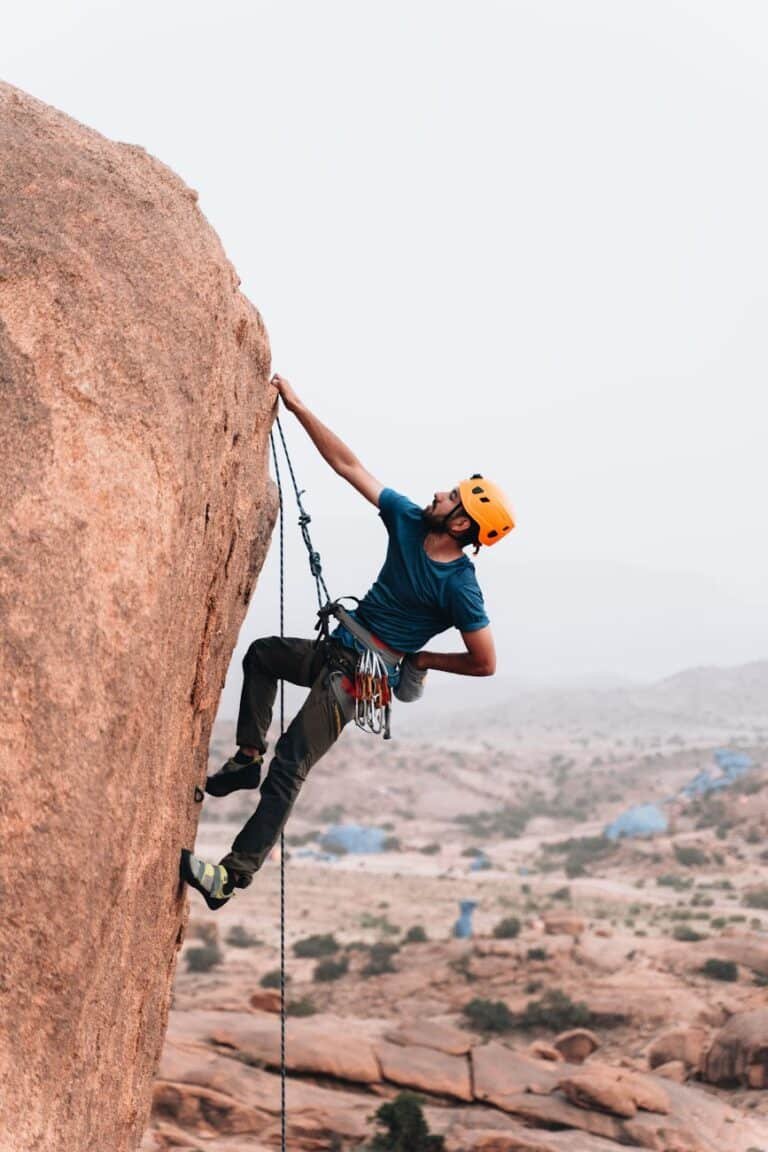 man rock climbing