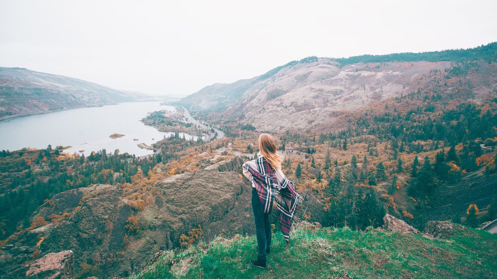 unrecognizable female tourist admiring lake in mountains. Where are you heading on the journey of life.