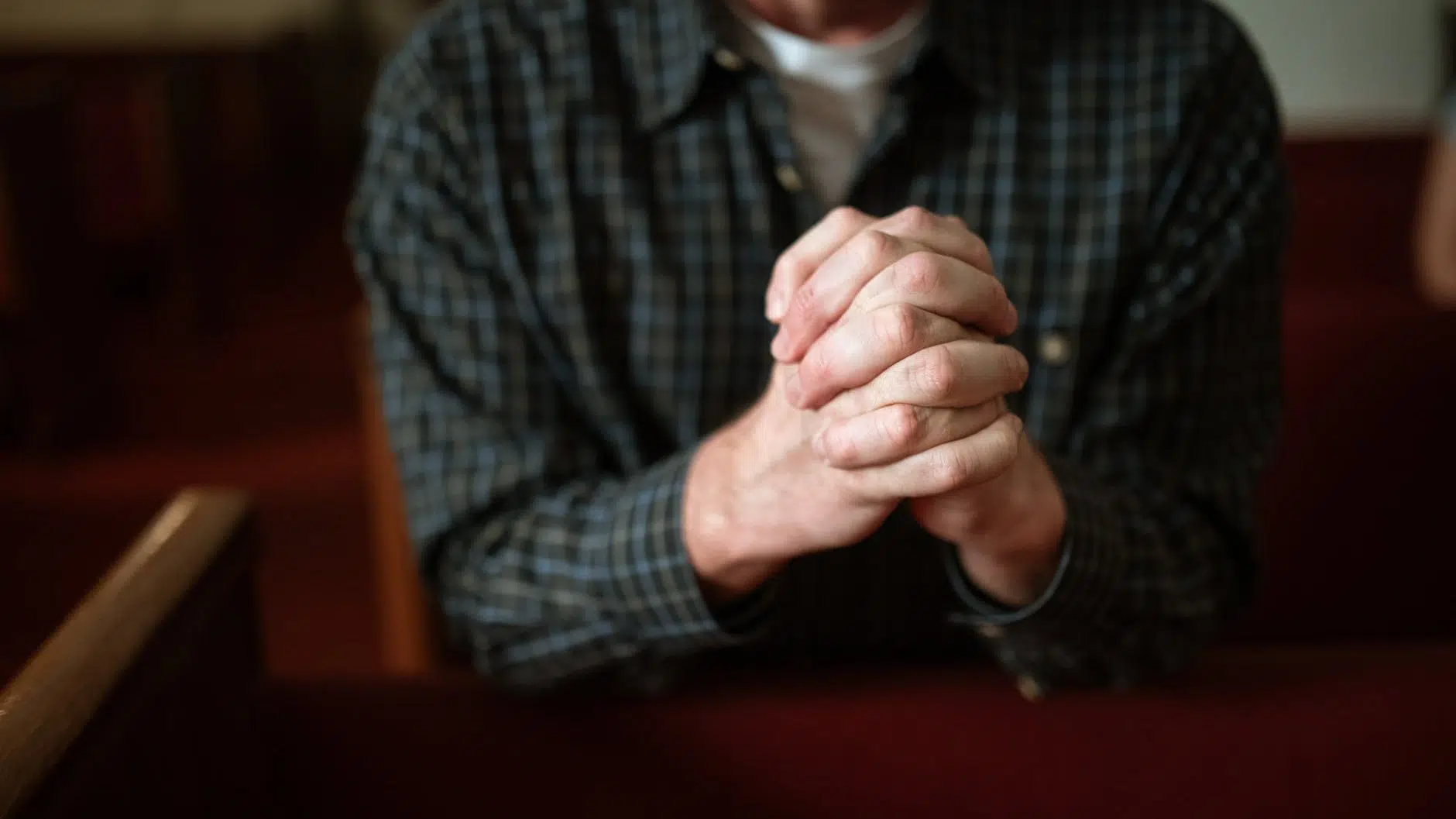 man in black and gray plaid dress shirt. Pray for a blessed life.