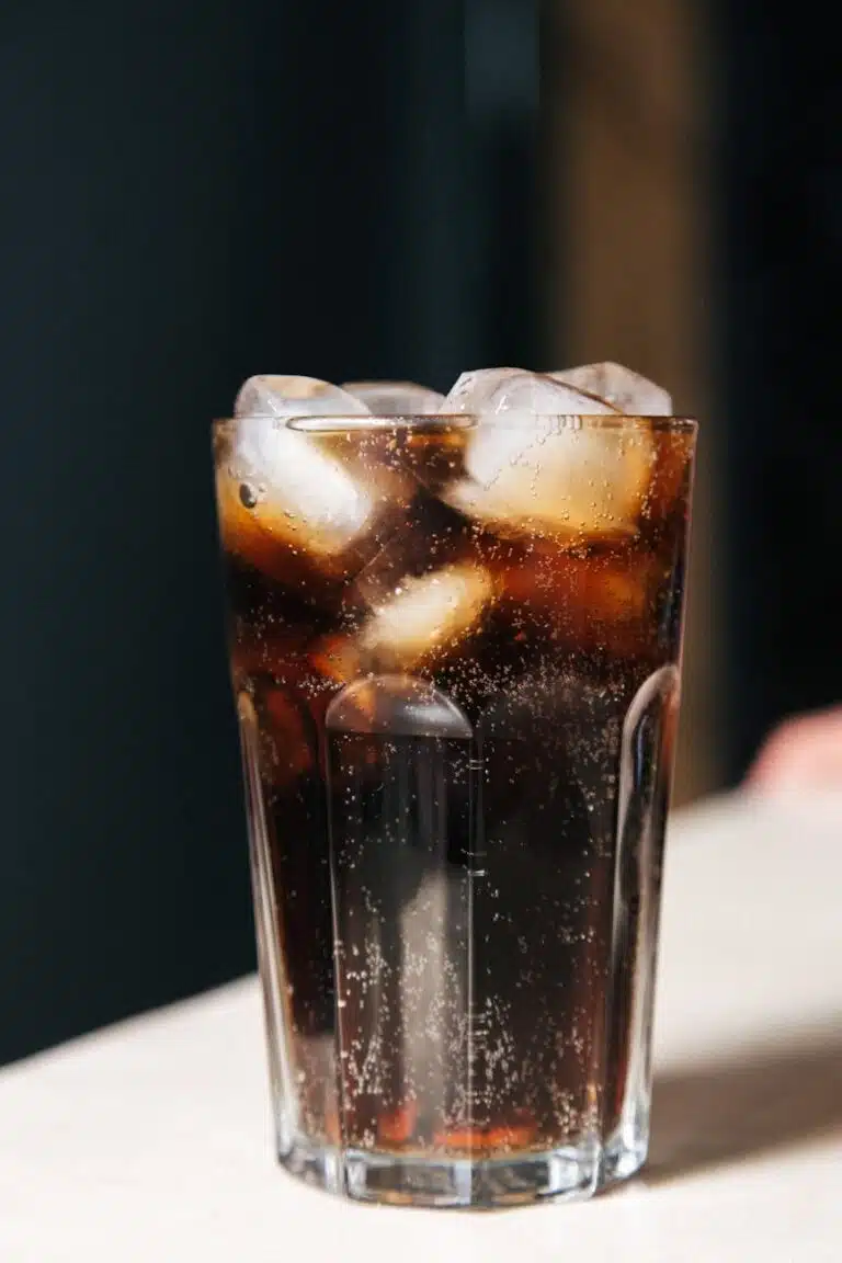 a glass of cold coca cola