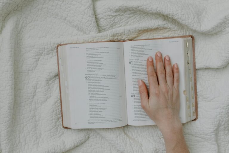 a person touching a page of a book