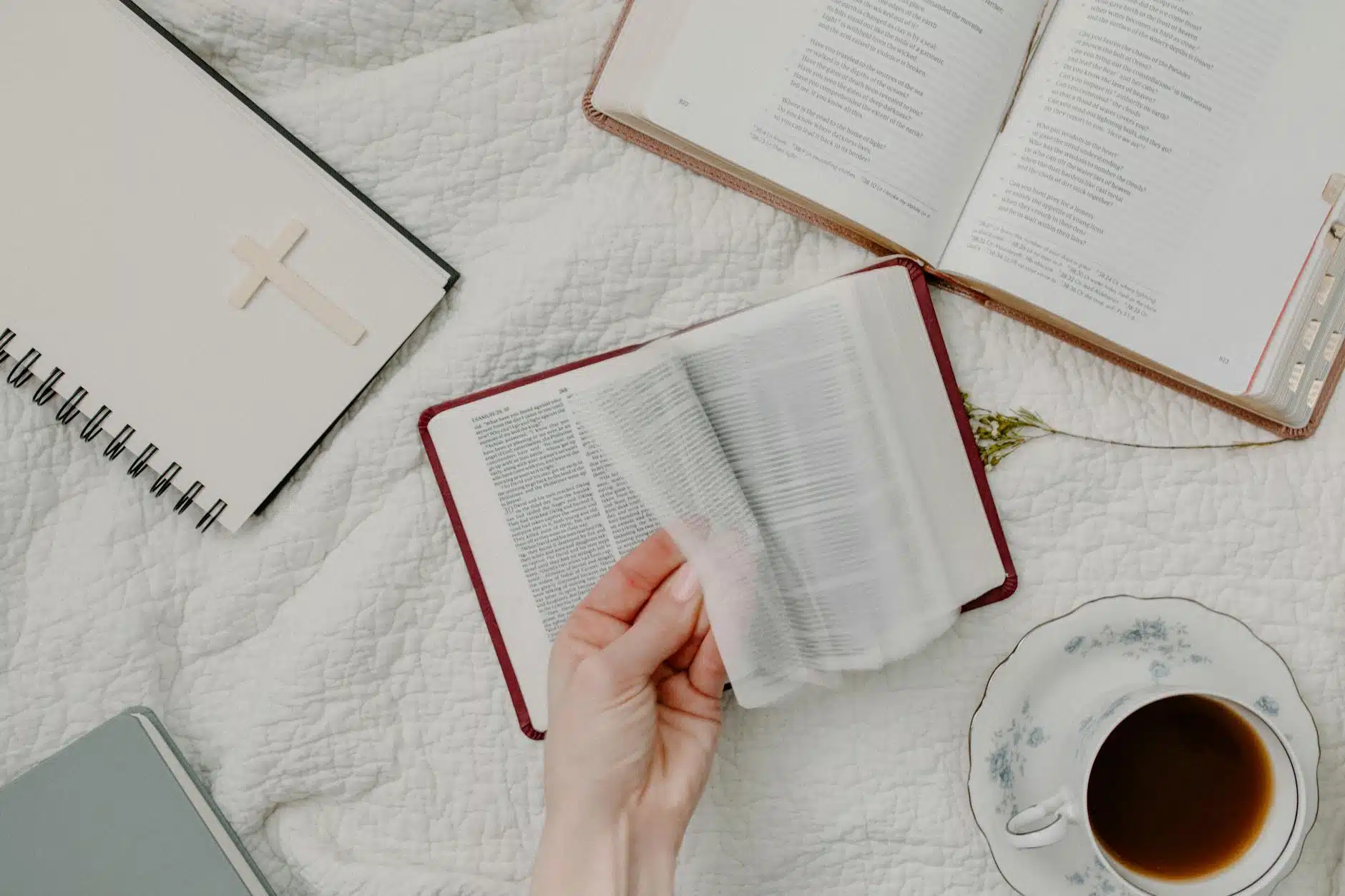 person holding white book page