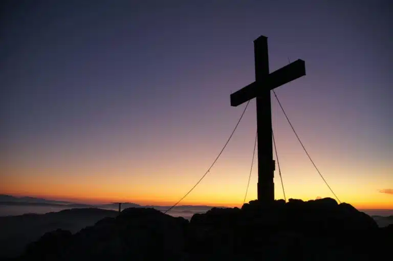 cross silhouette during golden hour