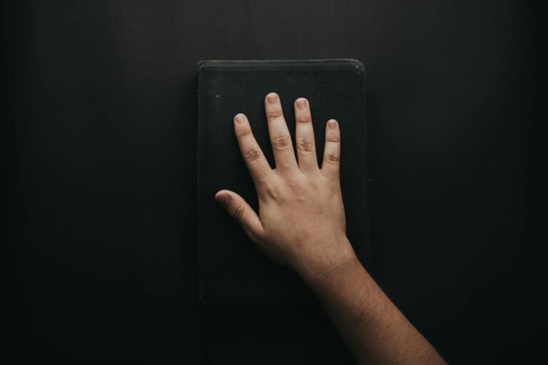 man touching book