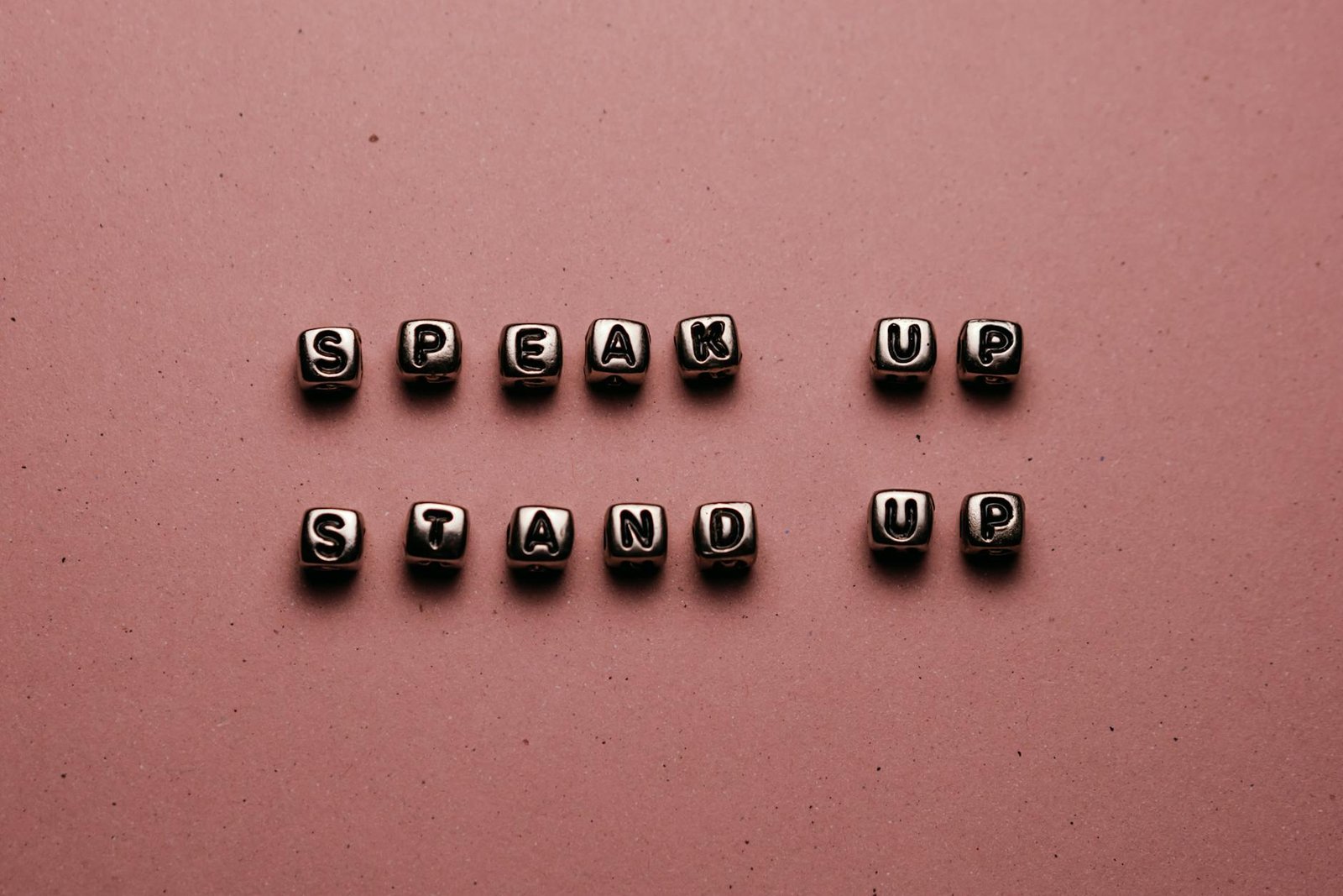 beads with letters on pink background