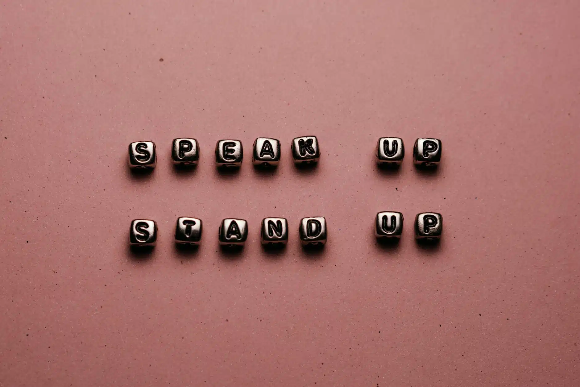 beads with letters on pink background