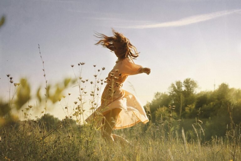 woman dancing in a field