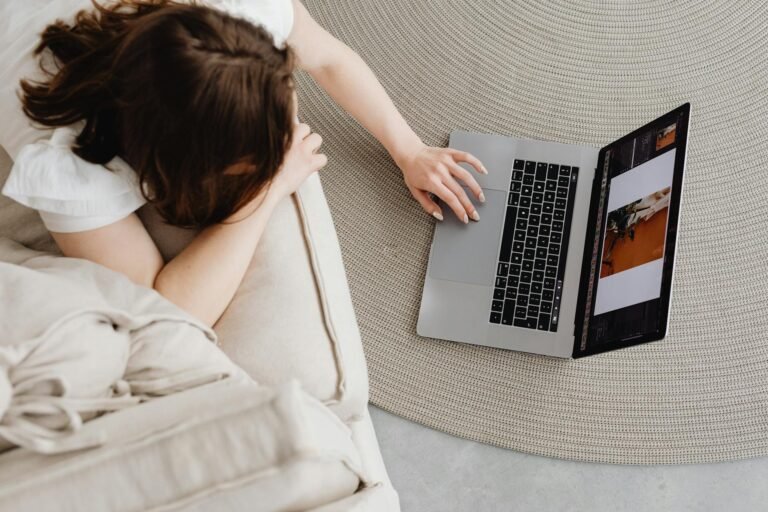 woman using laptop on the floor