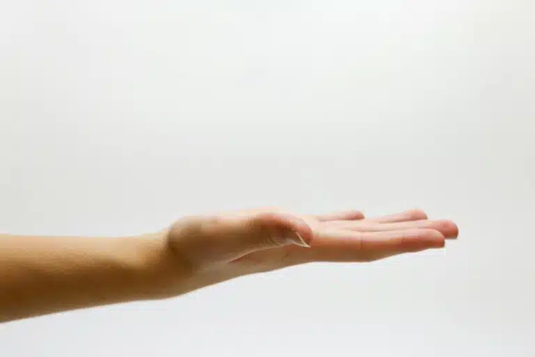close up of hand over white background